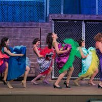 Community Theatre actors dancing in Leawood Stage Company's free summer production of the musical West Side Story