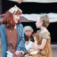 Community Theatre actors dancing in Leawood Stage Company's free summer production of Annie